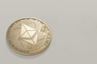 round gold colored ethereum coin